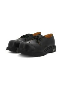 Scarpe in pelle nera con punta arrotondata, suola piatta e design con lacci. Presentano un interno a contrasto marrone e dettagli in metallo argentato.