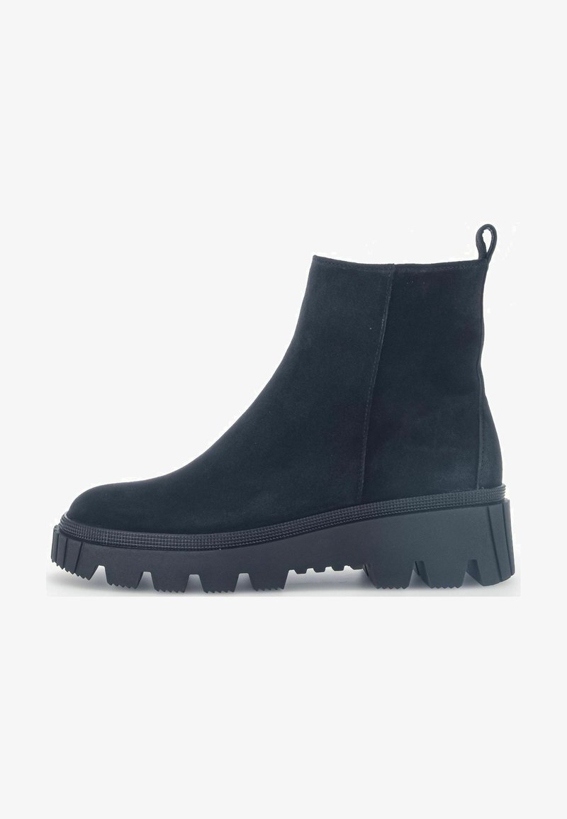 Black suede ankle boot with a high, chunky platform sole and textured lug outsole, featuring a pull tab for easy wear.