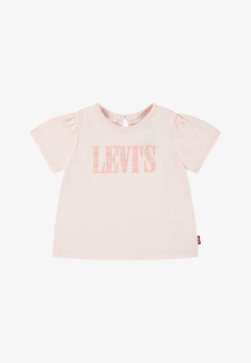 Gaiši rozā kokvilnas t-krekls ar īsām puff piedurknēm, apaļu kakla izgriezumu, aizmugures pogu aizdari un "LEVI'S" logotipu nedaudz tumšākā tonī.