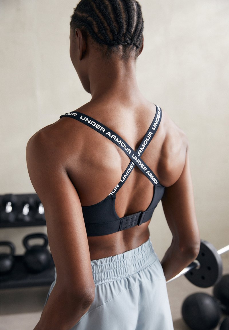 Under Armour - INFINITY MID BRA - Vidēja atbalsta sporta krūšturis - black/white, Palielināt