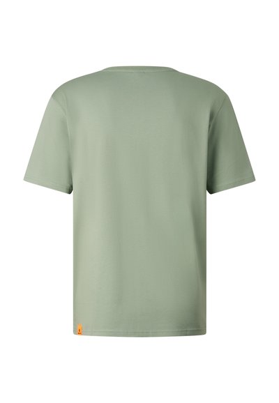 T-shirt uni vert clair à manches courtes, vu de dos, avec une petite étiquette orange en bas de l'ourlet.