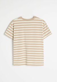 Koszulka w paski z poziomymi, kremowymi i jasnobrązowymi pasami, z krótkimi rękawami i okrągłym dekoltem. Miękka tekstura dzianiny jersey.