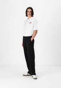 Abercrombie & Fitch Essential Baggy Open-Hem Sweatpant - Tréningruha alsók - black beauty