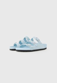 Blue rubber sandals with three adjustable straps and silver buckle hardware. Black textured sole offers traction and comfort.