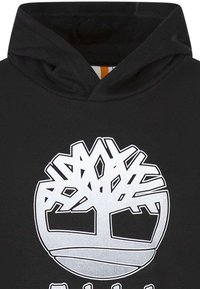 Hoodie noir avec un grand logo d'arbre blanc sur le devant. Tissu doux avec une coupe décontractée et une capuche à double épaisseur.