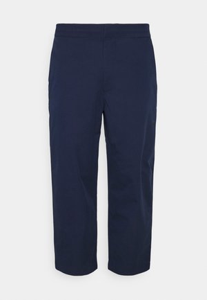 Navy blue cropped pants with a straight leg cut and elastic waistband, shown against a plain white background.
