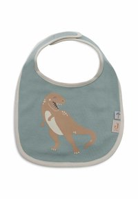 Bavoir sur le thème des dinosaurs en tissu bleu doux, présentant un design de T-rex couleur sable, un bord beige et une petite étiquette avec un logo de palmier.