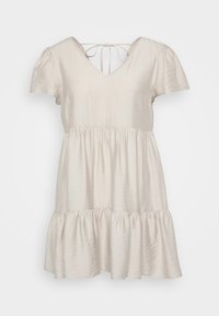 Μπεζ φόρεμα κοντό μανίκι με V-λαιμόκοψη, διαθέτει εφαρμοστό κορσέ και φουσκωτή, κλιμακωτή φούστα που τελειώνει πάνω από το γόνατο. Δένει στο πίσω μέρος του λαιμού.