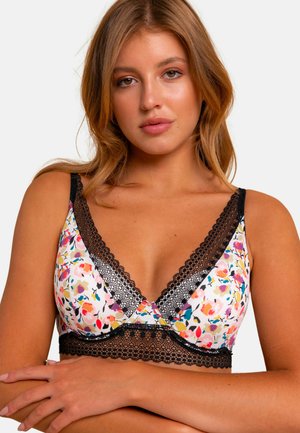 Bralette à motif floral en blanc avec des accents roses, jaunes et verts. Doté de dentelle noire et de bretelles réglables. Texture de tissu douce.