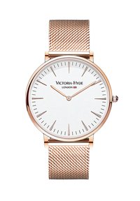 Reloj de oro rosa con correa de malla, esfera blanca, marcadores de hora minimalistas y el nombre de la marca "Victoria-Hyde London" en la parte superior.