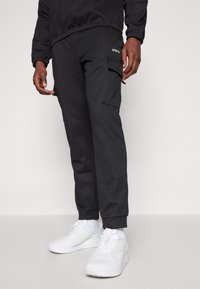 Jack & Jones Performance JPSTGORDON JJBASIC ICE CARGO PANTS - Hlače - black