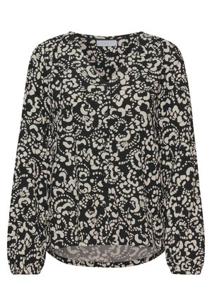 Blouse noire avec motif floral blanc, manches longues, décolleté en V, devant boutonné et ourlet légèrement arrondi. Tissu léger et lisse.