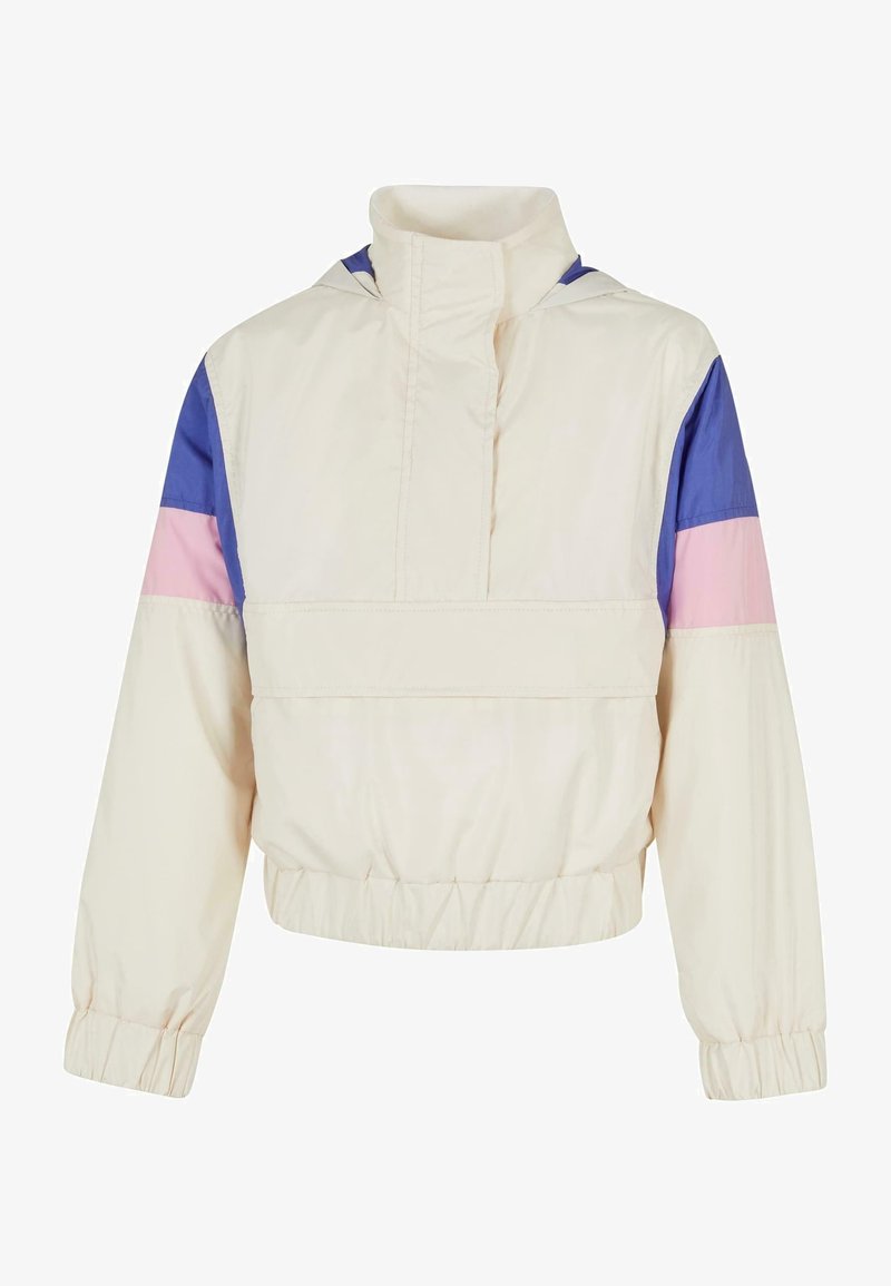 Veste légère et cropped avec un corps crème, des panneaux contrastés bleu, rose et violet. Elle dispose d'un col montant et de poignets élastiques.