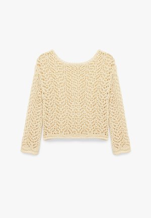 Crochet-paita vaaleassa beigestä, jossa on löysä malli, pitkät hihat, avara kaula-aukko ja avoin neulekuvio koko kankaan läpi.