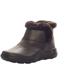 Braune Lederstiefeletten mit einem Kunstfellkragen, runder Zehenform und Gummisohle mit einer strukturierten Oberfläche für Grip und Komfort.