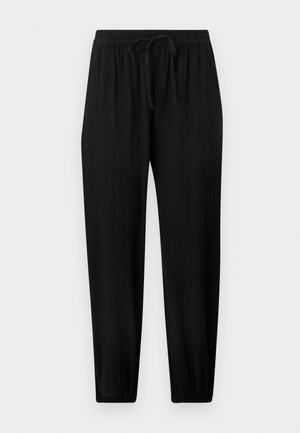 Pantalon noir ample avec taille élastique et cordon, jambes fuselées avec poignets élastiques, présenté sur un fond clair.