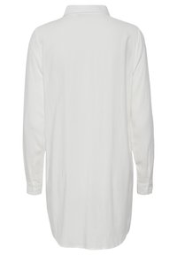 Chemise longue blanche à boutons, manches longues, poignets boutonnés et col classique, vue de dos.