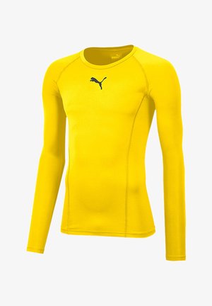 Long-sleeve athletic shirt in bright yellow, made from stretch fabric. Features a crew neckline and a blue Puma logo on the chest.