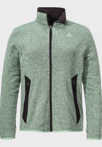 Grüne Strickjacke mit schwarzen Akzenten, hohem Kragen, Reißverschluss vorne und seitlichen Taschen; strukturierter Stoff mit einer weichen Oberfläche.