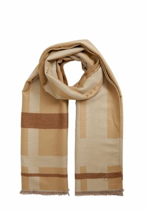 Beige sall, millefäärsete mustritega heledates ja tumedates toonides, pehme tekstuuriga ning fringsitud otstega, et lisada detaili.