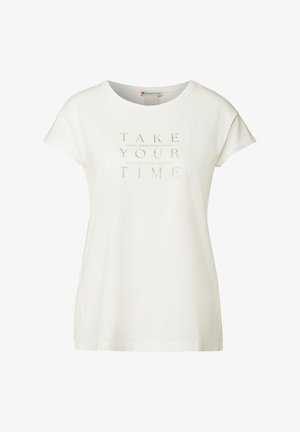 T-shirt en coton blanc avec un col rond, des manches courtes et un texte imprimé qui dit "PRENDS TON TEMPS NOUVEAU DÉPART NOUVEAU MOI."