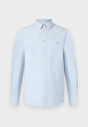 Camicia azzurro chiaro con bottoni, maniche lunghe, design con colletto, realizzata in tessuto strutturato con bottoni beige e un piccolo logo sul petto.
