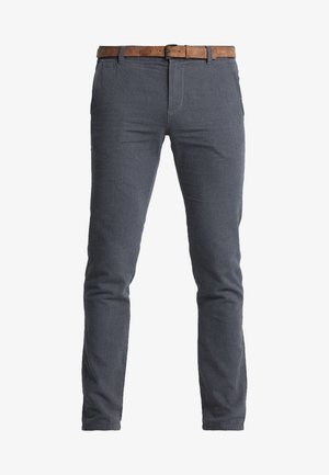 Halli tekstuuriga püksid slim fit lõikega, millel on pruun nahkline vöö ja klassikaline viie taskuga disain.
