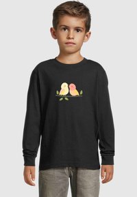 Long-sleeved black shirt featuring a graphic of two stylized birds in pastel colors on a branch, with green leaves.