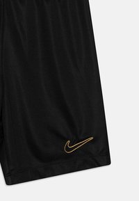 Nike Performance ACADEMY SHORT UNISEX - Pantalón corto de deporte - black/metallic gold