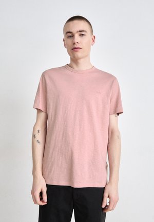 Pink short-sleeve t-shirt made of soft fabric, with a crew neckline and a small logo detail on the chest. Smooth texture, casual fit.