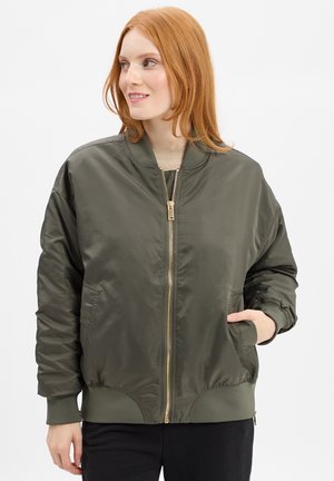 Olive green bomber jacket with a zip front, ribbed cuffs, and elastic hem. Features two side pockets and a smooth, shiny texture.