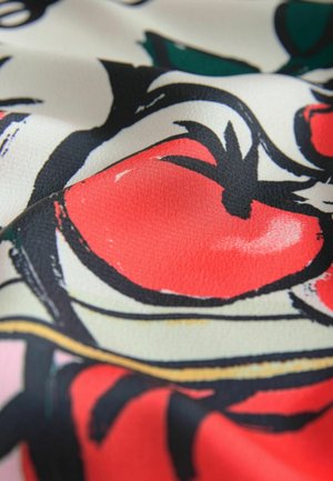 Fabric with a floral pattern featuring red tomatoes, black outlines, and green leaves; smooth texture and vibrant colors on a light background.