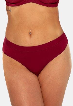 Burgunderfarbene nahtlose Unterwäsche mit breitem Bund. Glatter Stoff, niedriger Schnitt und keine sichtbaren Nähte sorgen für einen bequemen Sitz.