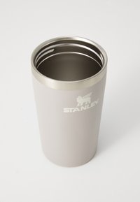 Stainless steel tumbler with a matte light gray exterior and shiny silver rim. Features the "STANLEY" logo near the base.