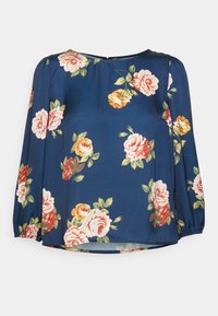 Blusa azul-marinho com um padrão floral apresentando rosas cor-de-rosa, amarelas e vermelhas. Mangas longas com punhos franzidos, decote redondo e tecido suave.