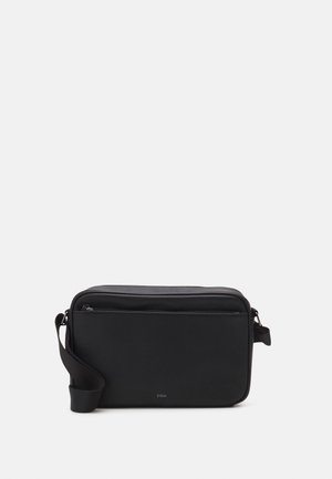 Sac bandoulière rectangulaire noir avec poche zippée à l'avant et sangle ajustable, marqué du logo "ZIGN" au centre en bas.