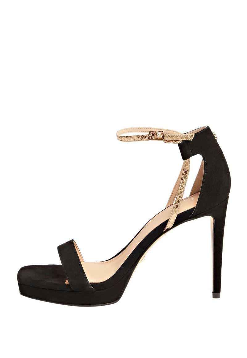 Chaussure à talons hauts en suede noir avec une plateforme, comportant une bande avant étroite, une sangle de cheville avec une texture serpent, et un bout pointu.