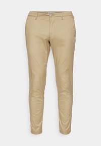 Pantalons beiges slim-fit en tissu doux en mélange de coton. Équipés de poches avant, d'une fermeture à bouton unique et d'ourlets droits.