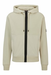 Felpa beige con zip, dotata di zip frontale nera, cappuccio regolabile con cordino, due tasche frontali e polsini e orlo a coste.