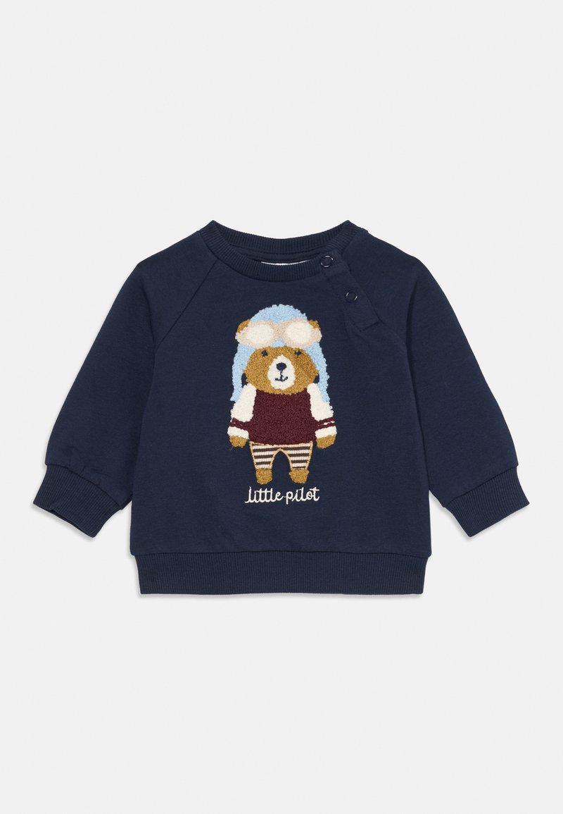 Mörkblå sweatshirt med en broderad björn i pilotkläder med goggles, randiga byxor och texten "liten pilot." Mjukt bomullsmaterial.