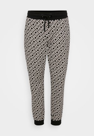 Melna un bēša rakstaina sporta bikses ar saites jostu un elastīgām piedurknēm, kurām visā virsmā ir sarežģīts ģeometrisks raksts.