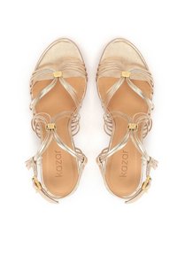 Gold metallic strappy sandals with crossed straps, a pointed toe, and a small heel. Features a gold-tone buckle and a tan insole.