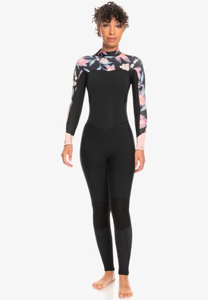 Wetsuit featuring a black body with floral-patterned sleeves, long sleeves, fitted design, and textured knee pads for added durability.
