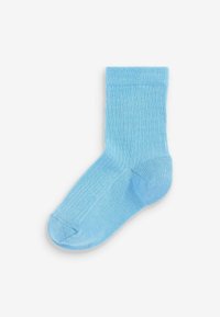 Calzino ribbed azzurro chiaro con finitura testurizzata, caratterizzato da un orlo dritto e punta rinforzata, adatto per vari outfit casual.