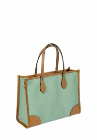 Borsa a spalla in materiale testurizzato verde menta con dettagli e manici in pelle marrone, caratterizzata da una forma strutturata e cuciture a contrasto.