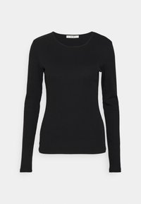 Must mustaga varrukatega särk sujuvast kangast. Ümar kaelus ja vormitunne disain. Minimalistlik ja ilma nähtavate mustrite või aktsentideta.