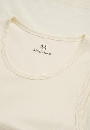 White tank top with ribbed texture, featuring a rounded neckline and tag displaying "Matinique" and a stylized 'M'.