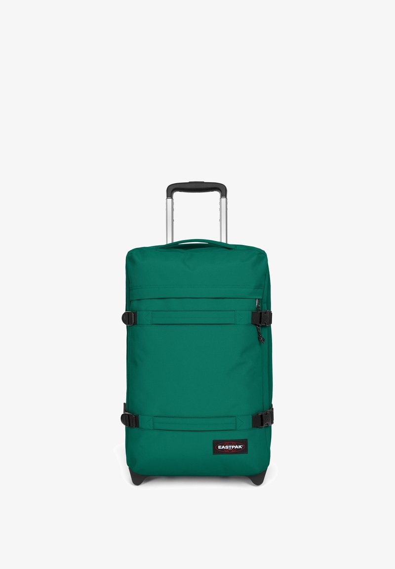 Valigia con rotelle in tessuto verde con manico retrattile, due cinturini con fibbia e accessori neri. Presenta un'etichetta con il marchio "EASTPAK" sulla parte anteriore.