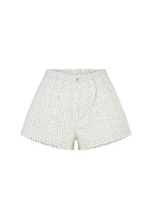 Weiße Baumwollshorts mit kleinem grünen und lila Blumenmuster und elastischem Bund, flach auf weißem Hintergrund liegend.