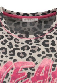 Short-sleeve top featuring a light gray fabric with a black leopard print, pink neckline, and bold, pink "YEAH" graphic at the bottom.